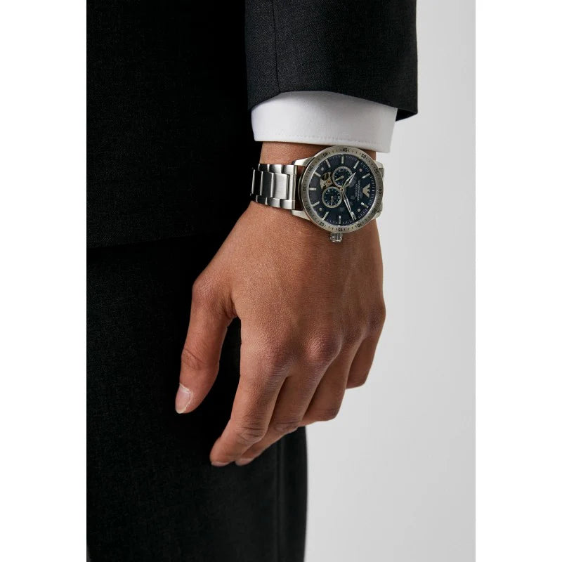 EMPORIO ARMANI AR60052 Mario Automatic Men's Watch with blue skeleton dial and silver stainless steel bracelet.